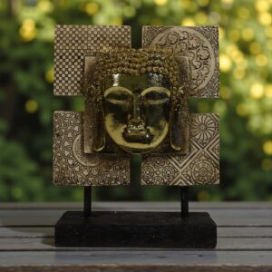 Golden Buddha Face Decor on Textured Blocks
